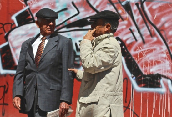 Men with caps, street art, Bogota, Colombia